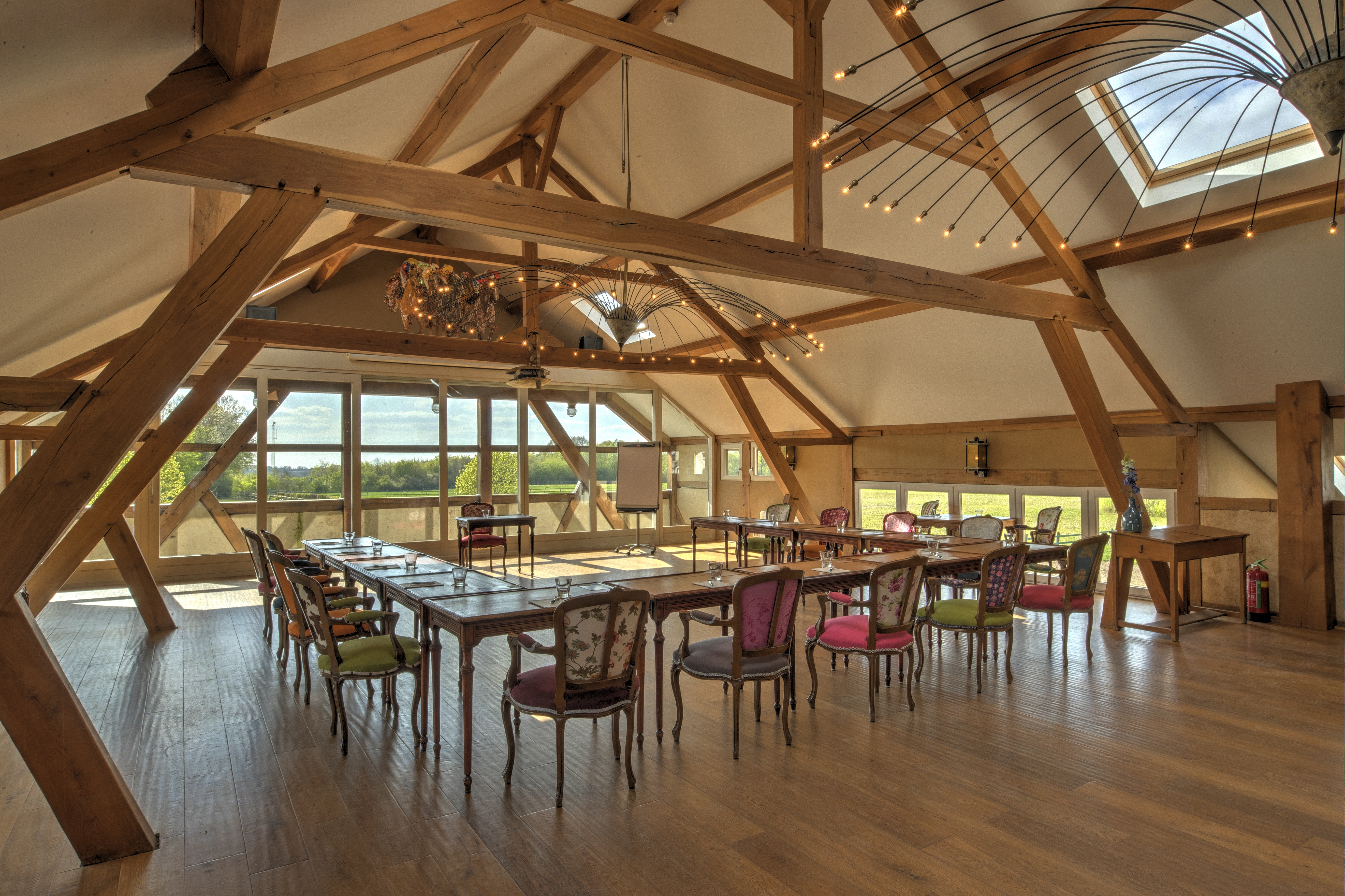 Offsite meeting room with high wooden roof and natural light for focus and creativity